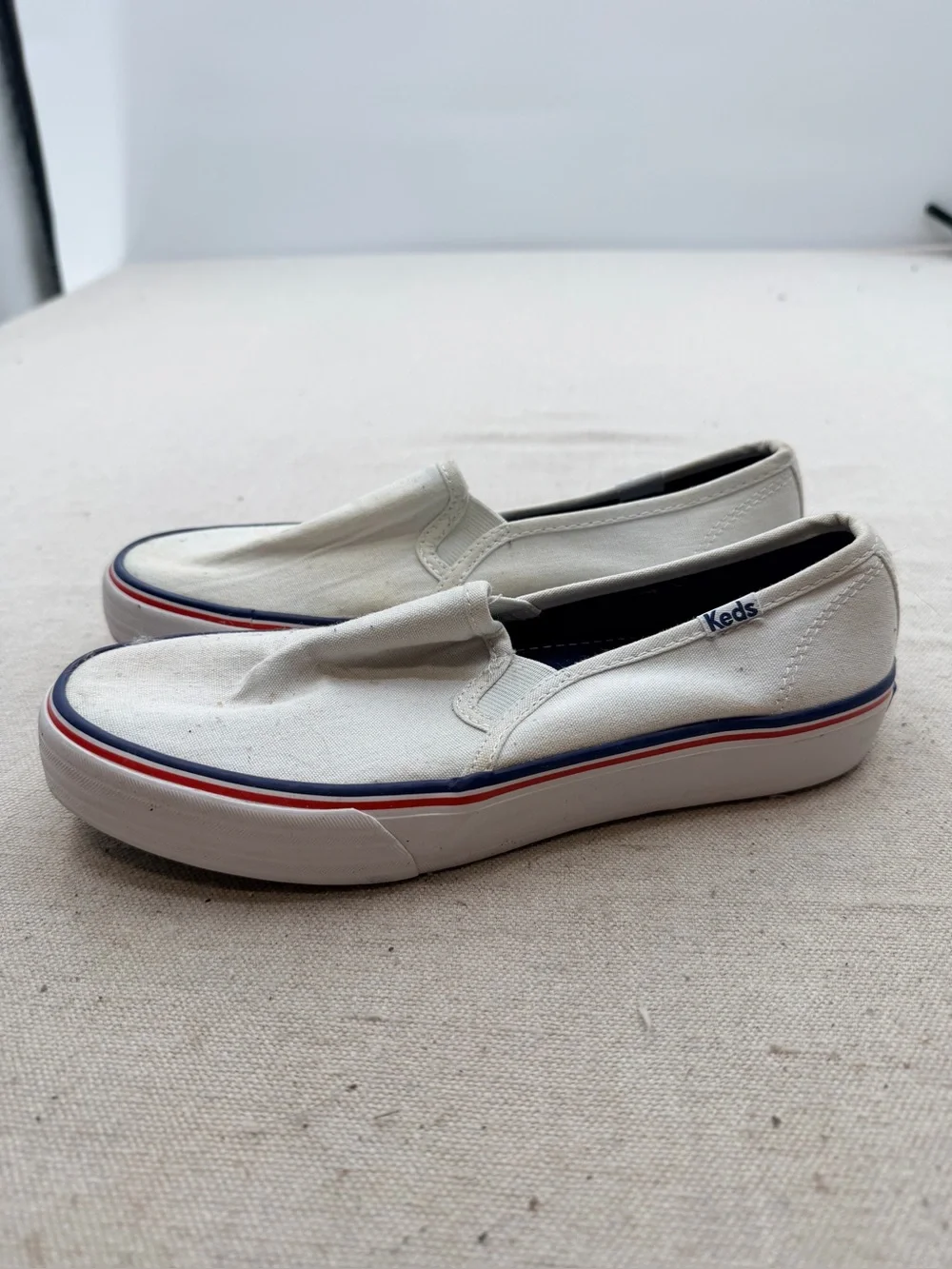 Keds White Canvas Slip-On Loafers with Red & Blue Trim